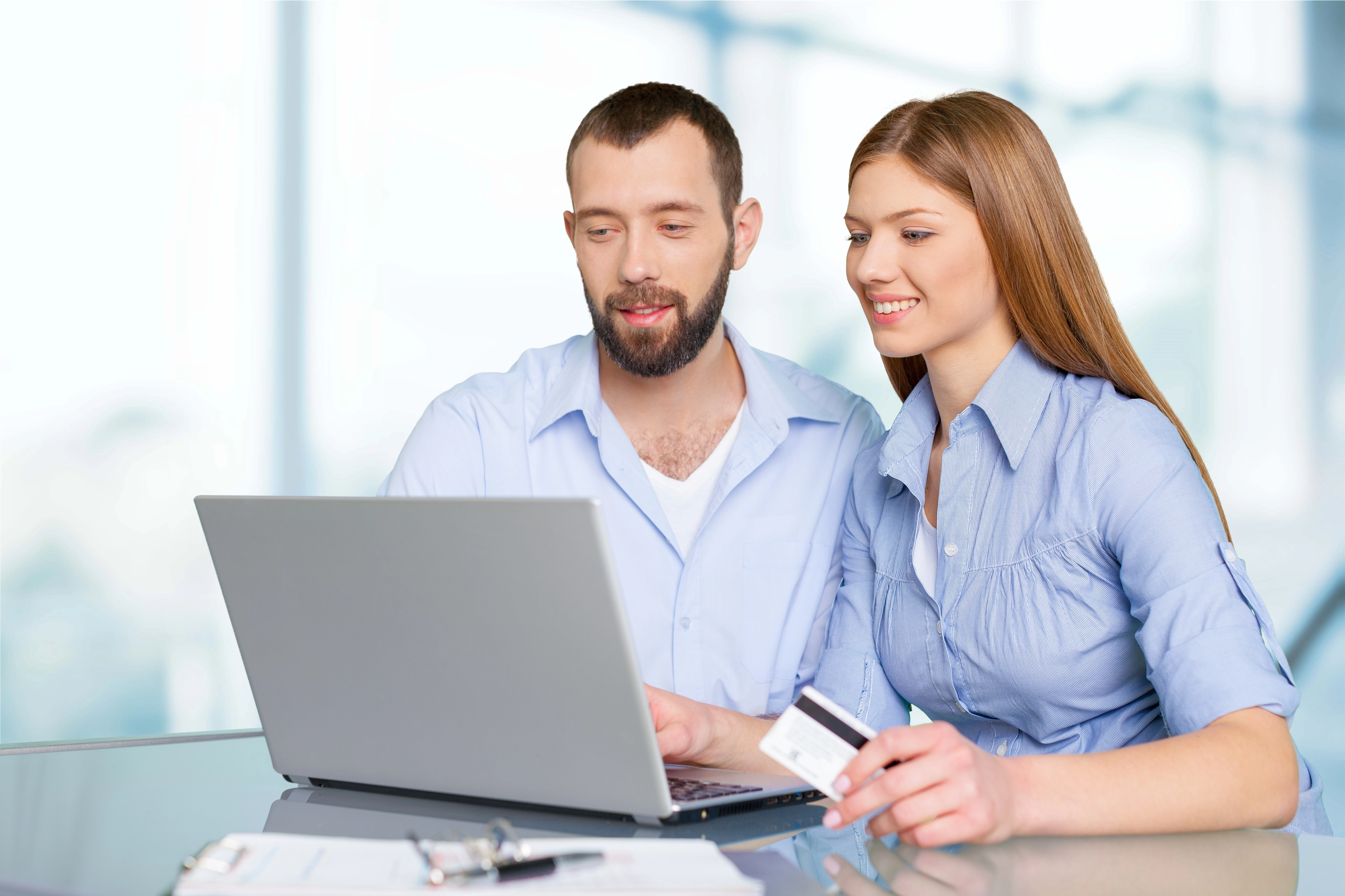 portrait-happy-couple-shopping-online-using-laptop-credit-card.webp